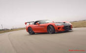 2009 Dodge Viper ACR - You're looking at Dodge's answer to the Porsche 911 GT3 RS or Lotus Exige, a road car you can drive to the track, hot lap all day, and drive back home, tires, brakes, and ego intact. The Viper ACR is raw. It's wired. And it's probably the best weekend racer yet from Detroit.