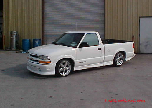 1999 Chevrolet Extreme pick-up with 18' chrome Ultras, and wide tires.