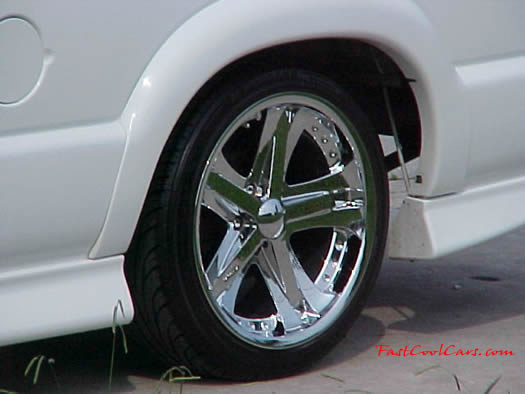 1999 Chevrolet Extreme pick-up with 18' chrome Ultras, and wide tires.