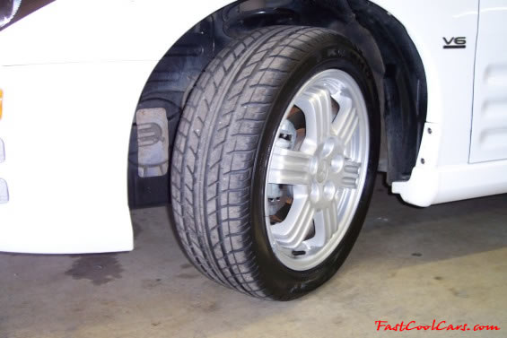Heather's Fast Cool Car - 2000 Mitsubishi Eclipse GT, Looks like brand new tires, on nice factory aluminum 17" wheels.