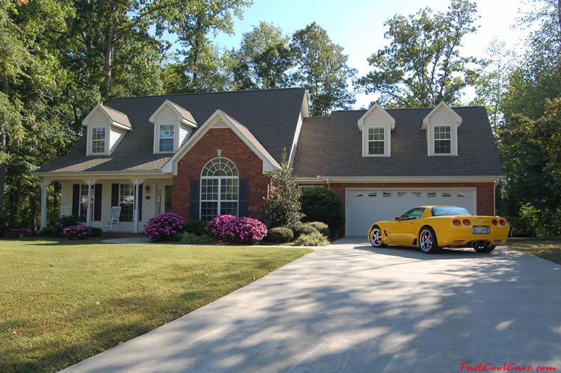 2002 Millennium Yellow supercharged & methanol injected Z06 Corvette, with many modifications, over 50 grand invested in the past 2+ years, for sale $38,000 what a deal. That whole garage is just for the Z06.
