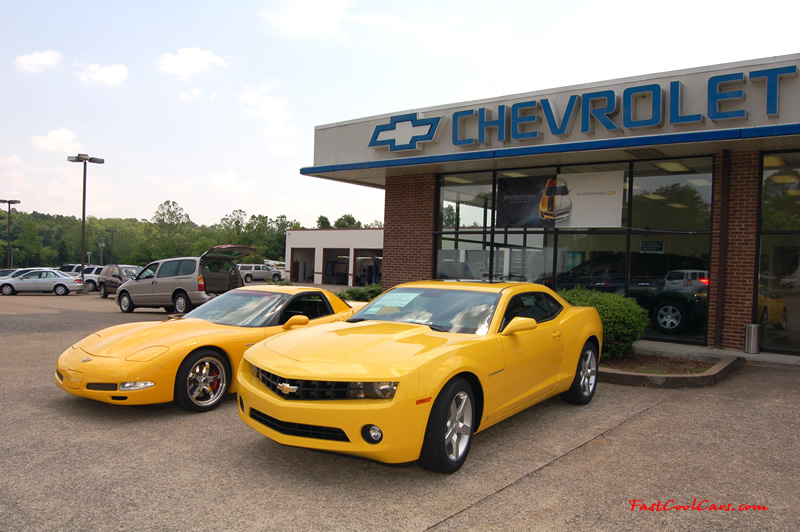 2010 Chevrolet Camaro 2LT and 2002 Supercharged Z06 Corvette, both in yellow.