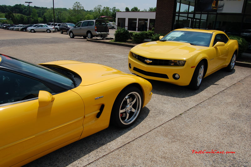 2010 Chevrolet Camaro 2LT and 2002 Supercharged Z06 Corvette, both in yellow.