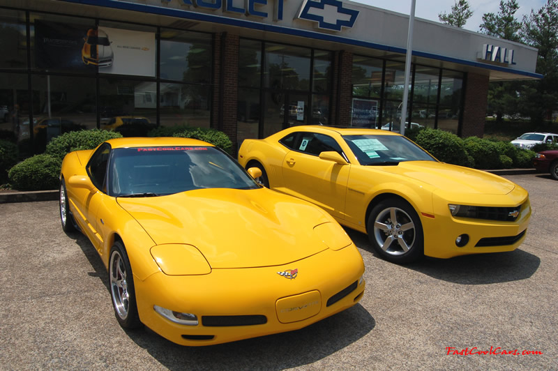 2010 Chevrolet Camaro 2LT and 2002 Supercharged Z06 Corvette, both in yellow.