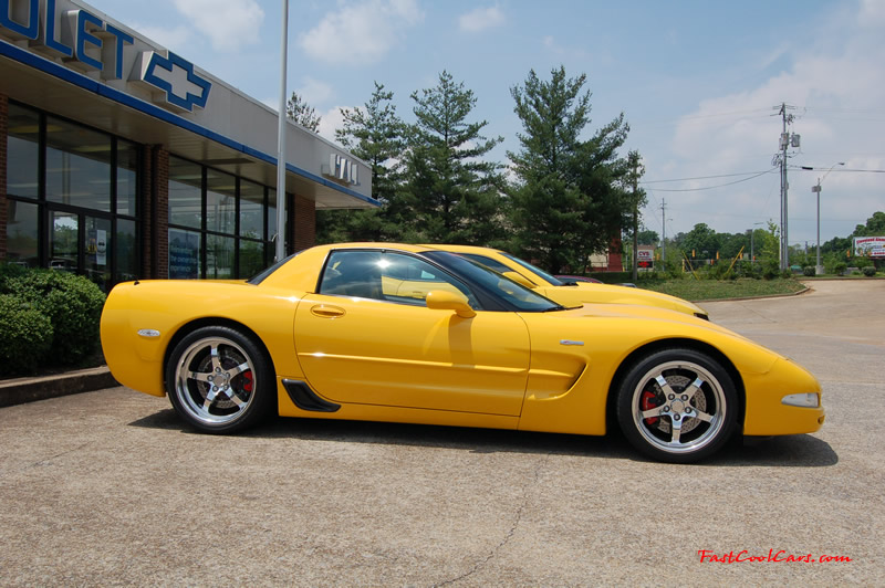 2010 Chevrolet Camaro 2LT and 2002 Supercharged Z06 Corvette, both in yellow.