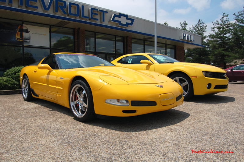 2010 Chevrolet Camaro 2LT and 2002 Supercharged Z06 Corvette, both in yellow.