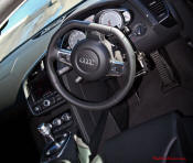 Audi R8 Designed to compete against the Porsche 911, the new Audi R8 features quattro permanent four-wheel drive, space frame aluminum body and the mid-mounted 420 bhp V8 FSI engine, and lots of carbon fiber.