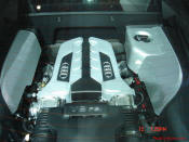 Audi R8 Designed to compete against the Porsche 911, the new Audi R8 features quattro permanent four-wheel drive, space frame aluminum body and the mid-mounted 420 bhp V8 FSI engine, and lots of carbon fiber.