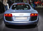 Audi R8 Designed to compete against the Porsche 911, the new Audi R8 features quattro permanent four-wheel drive, space frame aluminum body and the mid-mounted 420 bhp V8 FSI engine, and lots of carbon fiber.