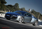 Audi R8 Designed to compete against the Porsche 911, the new Audi R8 features quattro permanent four-wheel drive, space frame aluminum body and the mid-mounted 420 bhp V8 FSI engine, and lots of carbon fiber.