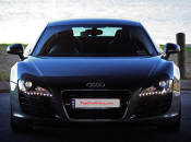 Audi R8 Designed to compete against the Porsche 911, the new Audi R8 features quattro permanent four-wheel drive, space frame aluminum body and the mid-mounted 420 bhp V8 FSI engine, and lots of carbon fiber.