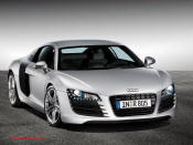 Audi R8 Designed to compete against the Porsche 911, the new Audi R8 features quattro permanent four-wheel drive, space frame aluminum body and the mid-mounted 420 bhp V8 FSI engine, and lots of carbon fiber.