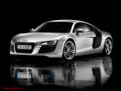 Audi R8 Designed to compete against the Porsche 911, the new Audi R8 features quattro permanent four-wheel drive, space frame aluminum body and the mid-mounted 420 bhp V8 FSI engine, and lots of carbon fiber.