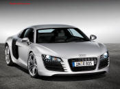 Audi R8 Designed to compete against the Porsche 911, the new Audi R8 features quattro permanent four-wheel drive, space frame aluminum body and the mid-mounted 420 bhp V8 FSI engine, and lots of carbon fiber.