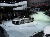 Audi R8 Designed to compete against the Porsche 911, the new Audi R8 features quattro permanent four-wheel drive, space frame aluminum body and the mid-mounted 420 bhp V8 FSI engine, and lots of carbon fiber.