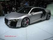 Audi R8 Designed to compete against the Porsche 911, the new Audi R8 features quattro permanent four-wheel drive, space frame aluminum body and the mid-mounted 420 bhp V8 FSI engine, and lots of carbon fiber.