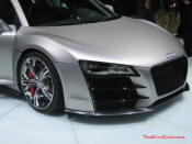 Audi R8 Designed to compete against the Porsche 911, the new Audi R8 features quattro permanent four-wheel drive, space frame aluminum body and the mid-mounted 420 bhp V8 FSI engine, and lots of carbon fiber.