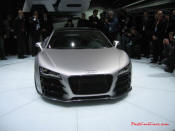 Audi R8 Designed to compete against the Porsche 911, the new Audi R8 features quattro permanent four-wheel drive, space frame aluminum body and the mid-mounted 420 bhp V8 FSI engine, and lots of carbon fiber.