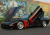 C5 Chevrolet Z06 Corvette 2001 - 2004, 385 to 405 horsepower, Aluminum block and heads LS6, all with 6 speeds.  America's sport car in Black, with mod red interior. And a killer flame paint job.