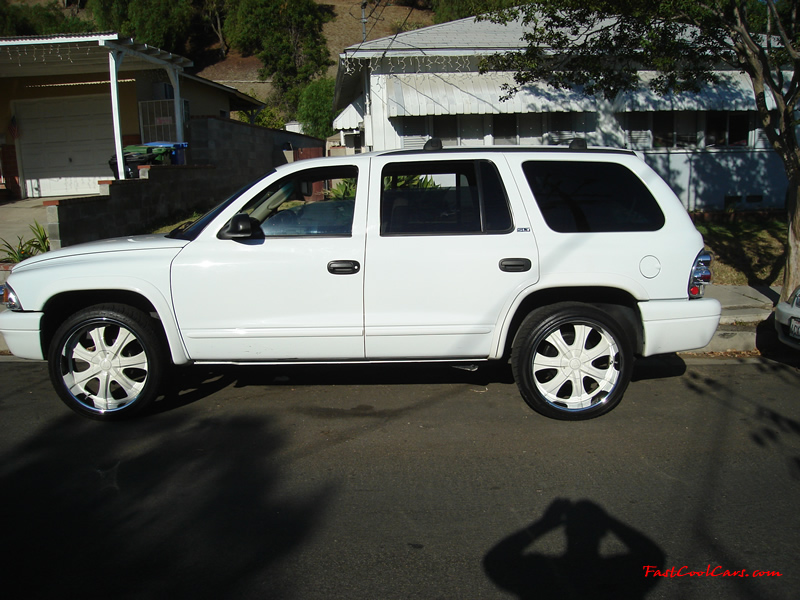 2002 Dodge Durango SLT 4.7 White w/white powder coated rims Third row seat, Roof Rack, tinted windows, 22" velocity white rims, 5" chrome lip, lexani tires, Brand new Gabriel Shocks all around