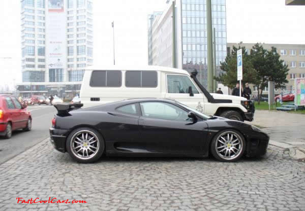 Very Fast Cool Exotic Supercar, sweet black paint job, and nice rear spoiler.