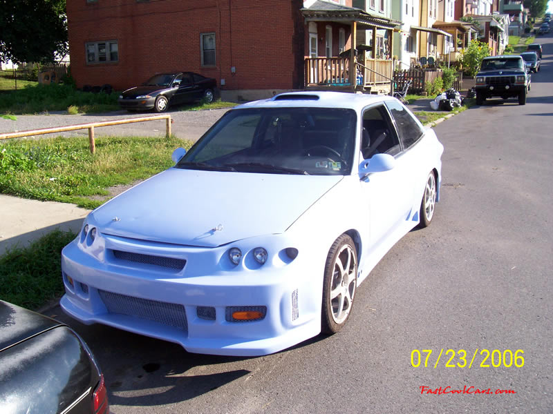 1994 Ford Escort with Honda body kit Corvette tail lights, and more.