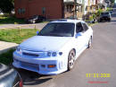 1994 Ford Escort with Honda body kit Corvette tail lights, and more.