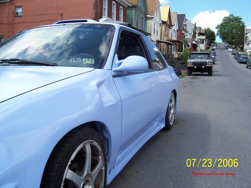 1994 Ford Escort with Honda body kit Corvette tail lights, and more.