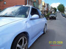 1994 Ford Escort with Honda body kit Corvette tail lights, and more.