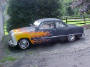 1950 Ford club coupe - better known as a shoebox. with custom flame paint job.