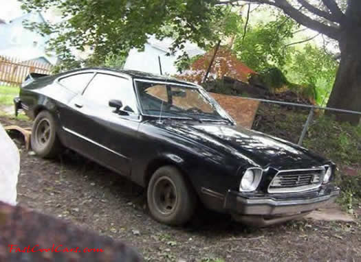 1974 Black Ford Mustang, 302 with C4 suto transmission.