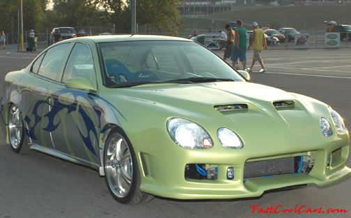 Lowriders that have been lowered, dropped, slammed, and scraping.
