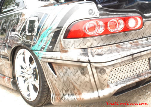 Lowriders that have been lowered, dropped, slammed, and scraping. Killer paint job.