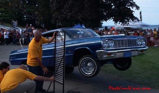 Lowriders that have been lowered, dropped, slammed, and scraping. Hydraulic bouncing height contest.