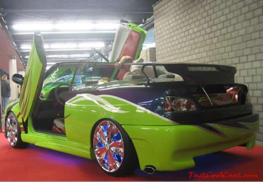 Lowriders that have been lowered, dropped, slammed, and scraping.