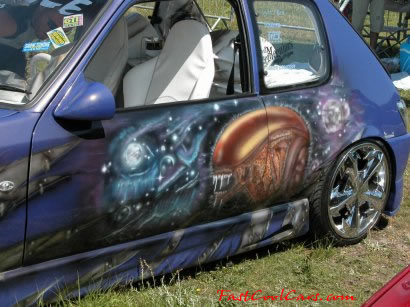 Lowriders that have been lowered, dropped, slammed, and scraping. killer paint job.