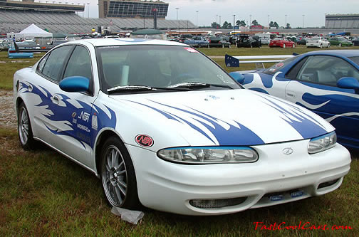 Lowriders that have been lowered, dropped, slammed, and scraping.