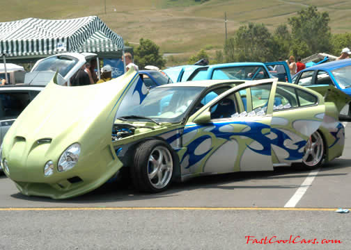 Lowriders that have been lowered, dropped, slammed, and scraping. Cool tilting hood.