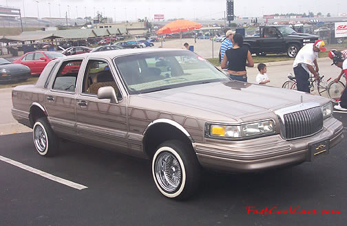 Lowriders that have been lowered, dropped, slammed, and scraping.