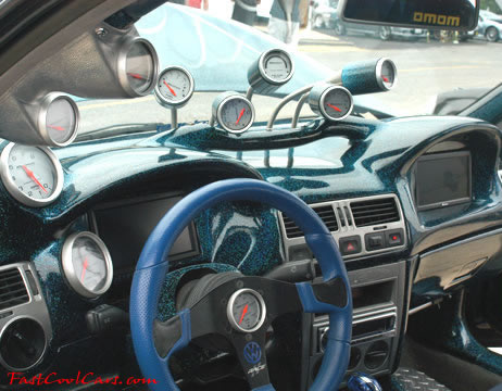 Lowriders that have been lowered, dropped, slammed, and scraping. Holy Cow, check out all the guages.