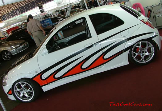 Lowriders that have been lowered, dropped, slammed, and scraping.