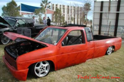 Lowrider pick-up that has been lowered, dropped, slammed, and scraping, using many different modifications.