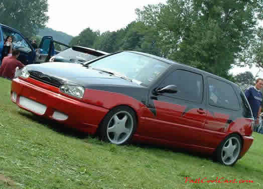 Lowriders that have been lowered, dropped, slammed, and scraping, using many different modifications.