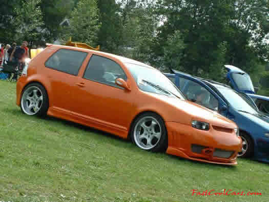 Lowriders that have been lowered, dropped, slammed, and scraping, using many different modifications.