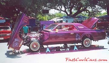 Lowriders that have been lowered, dropped, slammed, and scraping, using many different modifications.
