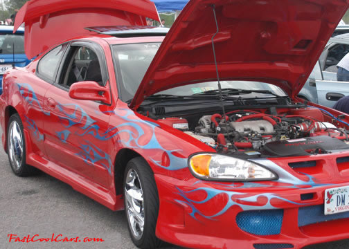 Lowriders that have been lowered, dropped, slammed, and scraping.