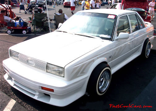 Lowriders that have been lowered, dropped, slammed, and scraping.
