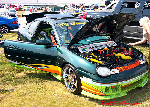 Lowriders that have been lowered, dropped, slammed, and scraping.