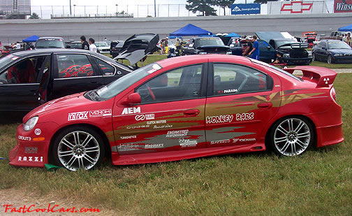 Lowriders that have been lowered, dropped, slammed, and scraping.