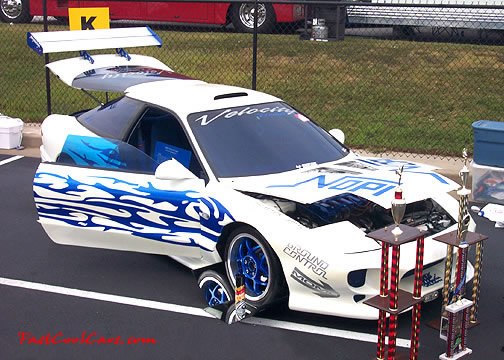 Lowriders that have been lowered, dropped, slammed, and scraping.